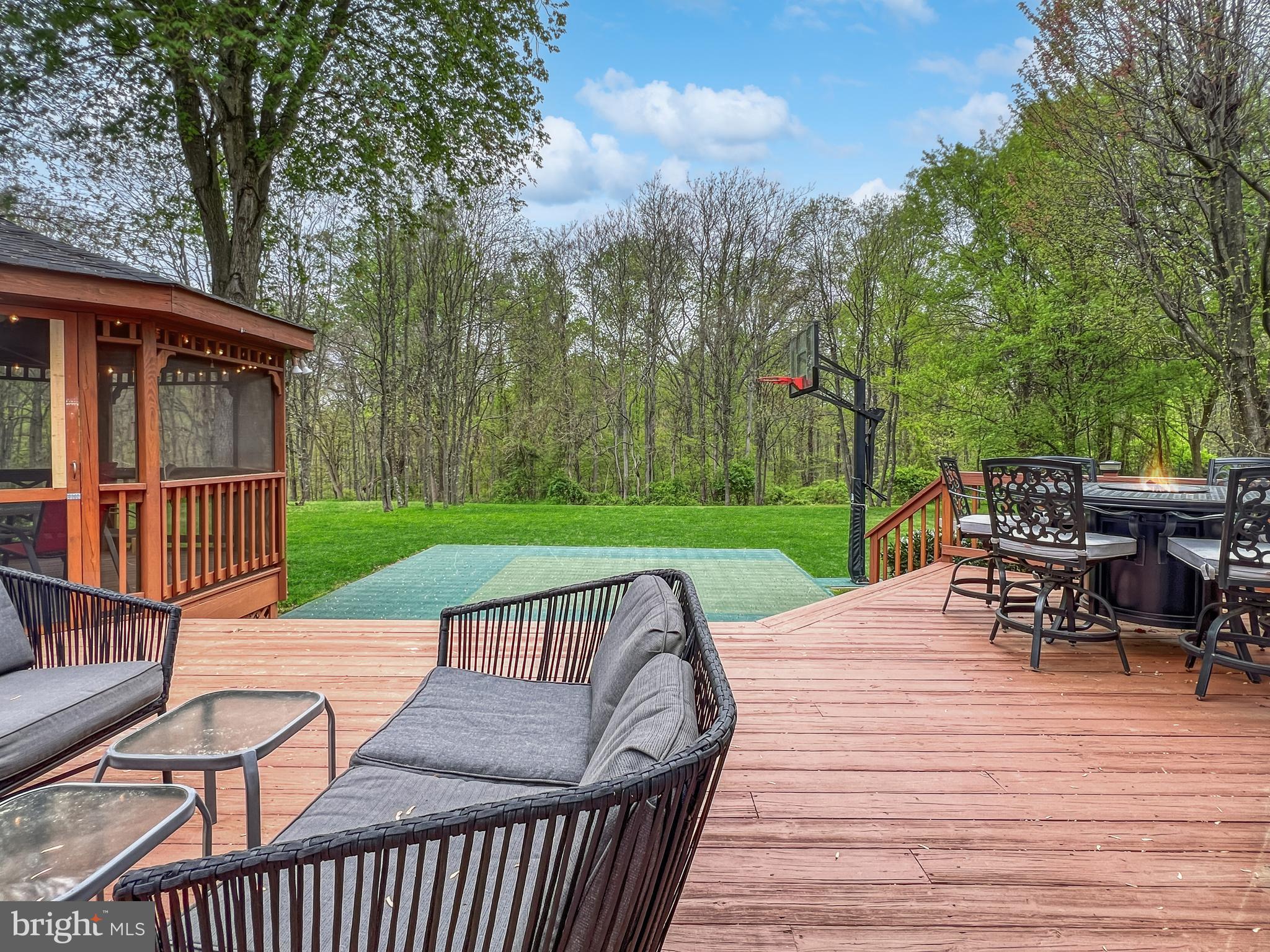 18210 Wickham Road Olney, MD 20832 - Photo 59 of 74 a view of a roof deck with chair and wooden floor