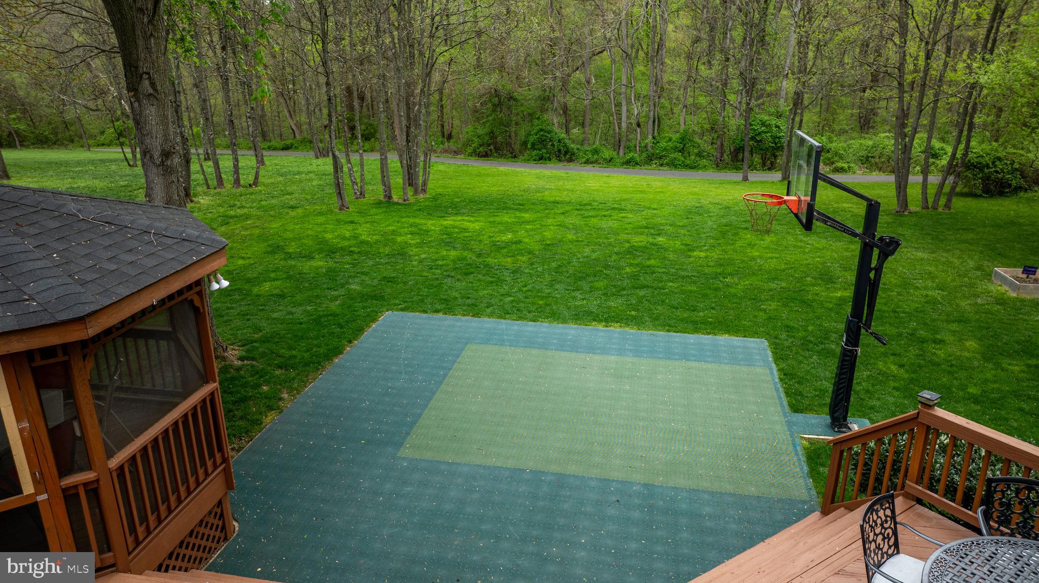 18210 Wickham Road Olney, MD 20832 - Photo 7 of 74 a view of backyard with deck and garden