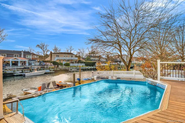 a view of a lake with boats and trees in the background