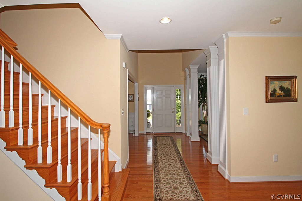 13336 Tipple Point Road Midlothian, VA 23114 - Photo 6 of 24 a view of a hallway with wooden floor and staircase