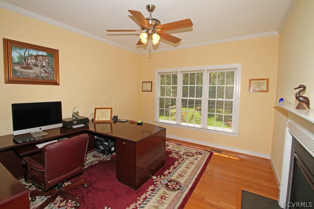 13336 Tipple Point Road Midlothian, VA 23114 - Photo 7 of 24 a living room with furniture a fireplace and a flat screen tv
