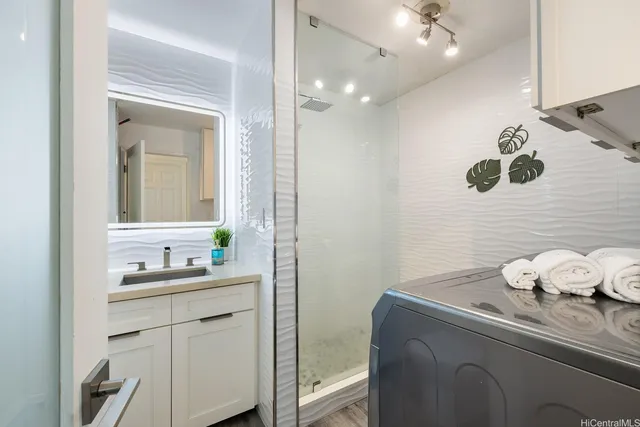 a bathroom with a sink and a mirror