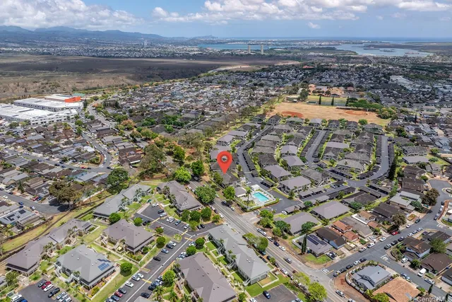 an aerial view of residential houses with outdoor space