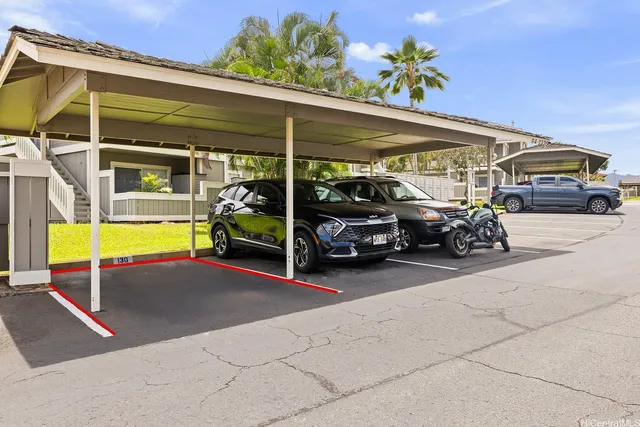 a view of parking garage with cars