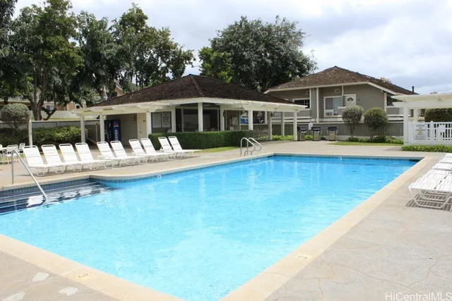 a front view of a house with swimming pool