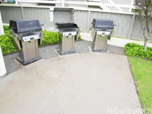 a view of outdoor kitchen with seating space