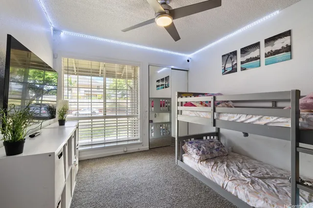 a bed room with a bed and a window