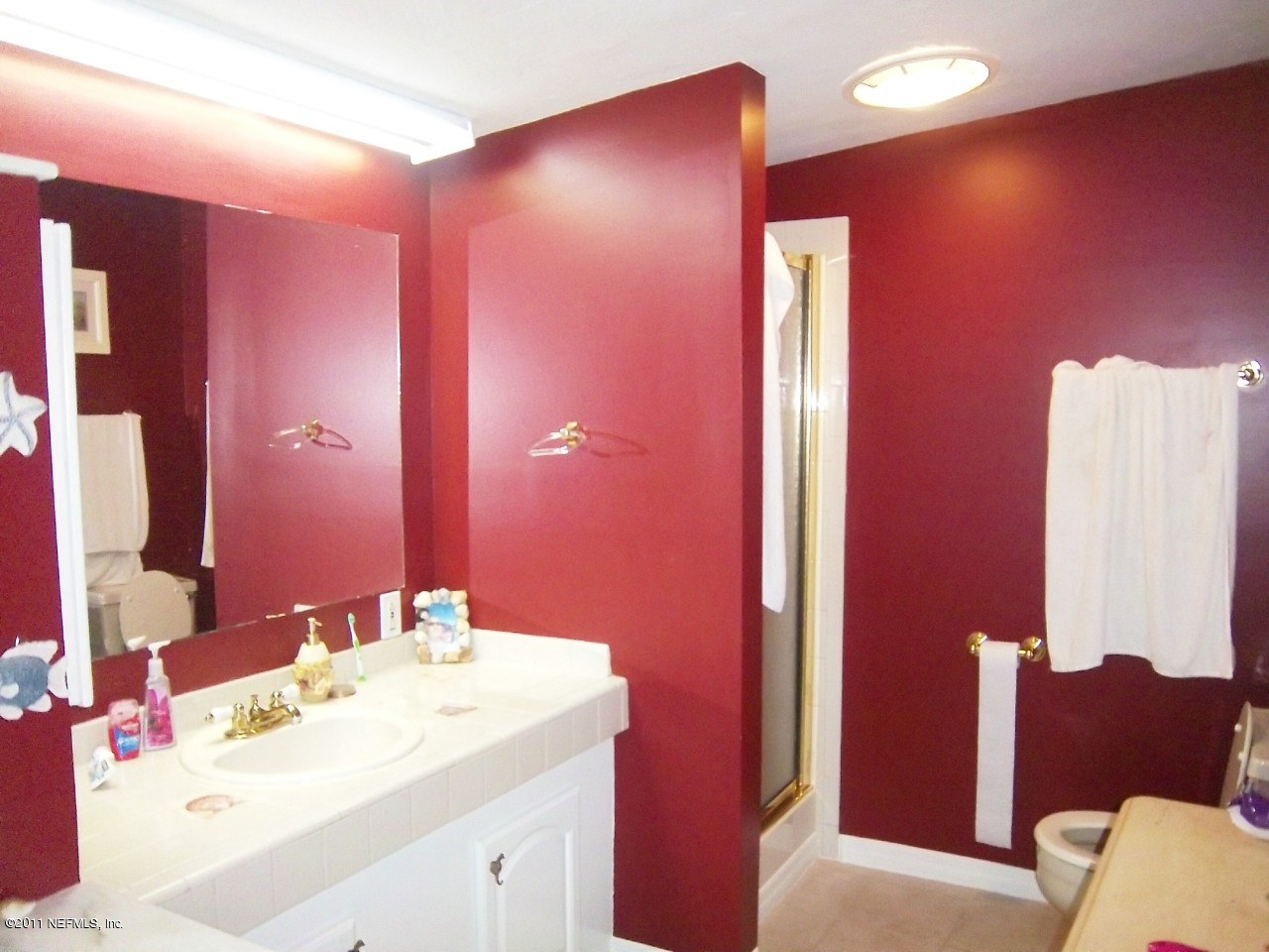 2771 Pellicer Road St. Augustine, FL 32092 - Photo 12 of 22 a bathroom with a sink vanity and a mirror