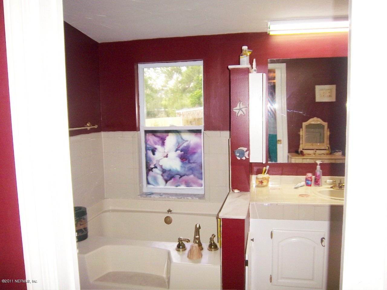 2771 Pellicer Road St. Augustine, FL 32092 - Photo 13 of 22 a bathroom with a sink and a mirror