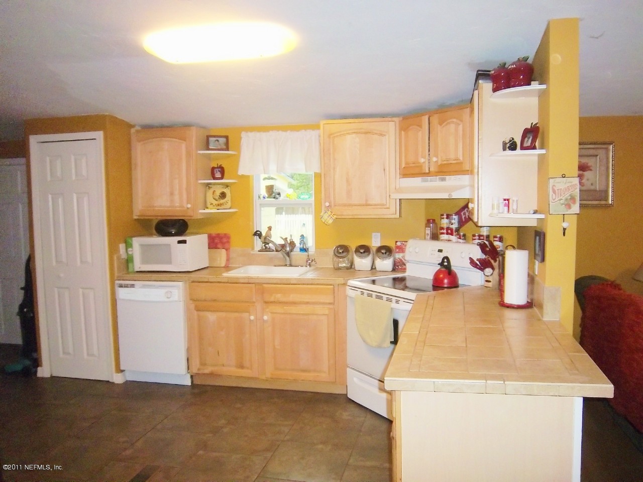 2771 Pellicer Road St. Augustine, FL 32092 - Photo 5 of 22 a kitchen with a sink a stove a refrigerator and cabinets