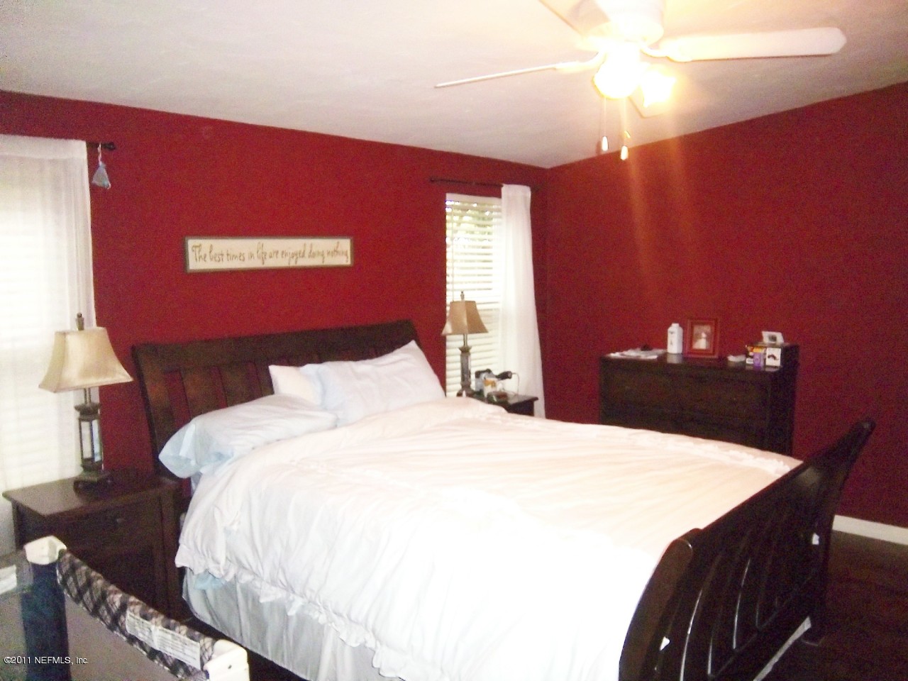 2771 Pellicer Road St. Augustine, FL 32092 - Photo 9 of 22 a bedroom with a bed and a chandelier