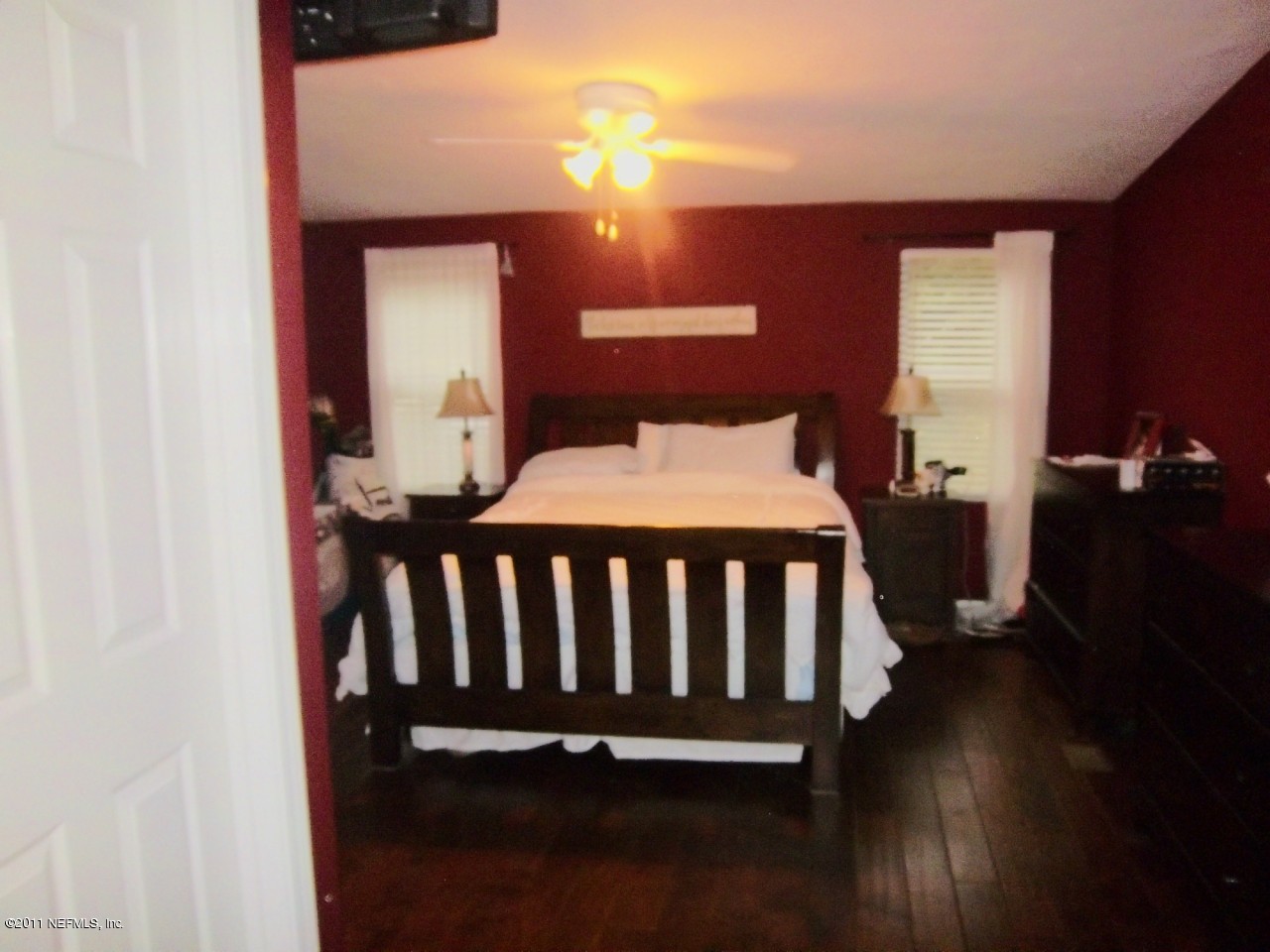 2771 Pellicer Road St. Augustine, FL 32092 - Photo 10 of 22 a bedroom with a bed and wooden floor
