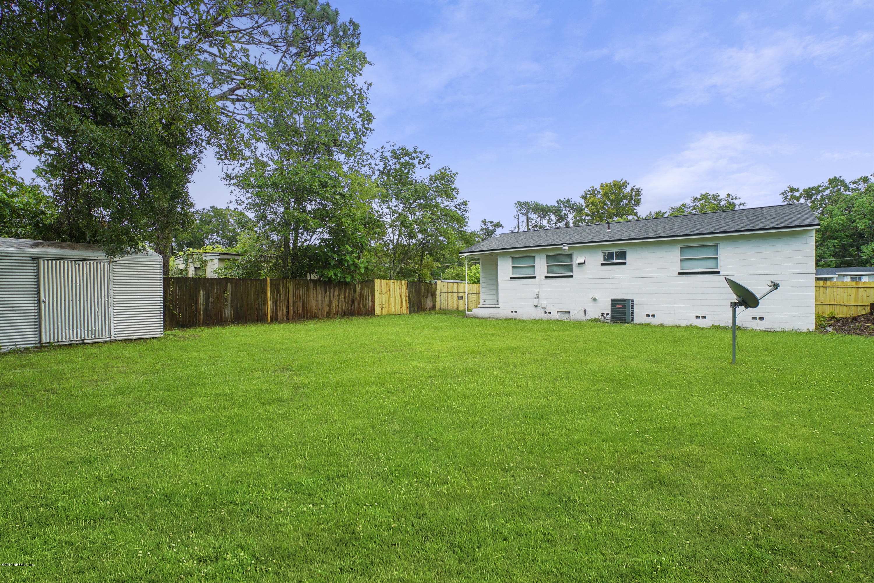 10506 Briarcliff Road South Jacksonville, FL 32218 - Photo 13 of 14 a front view of house with yard and green space