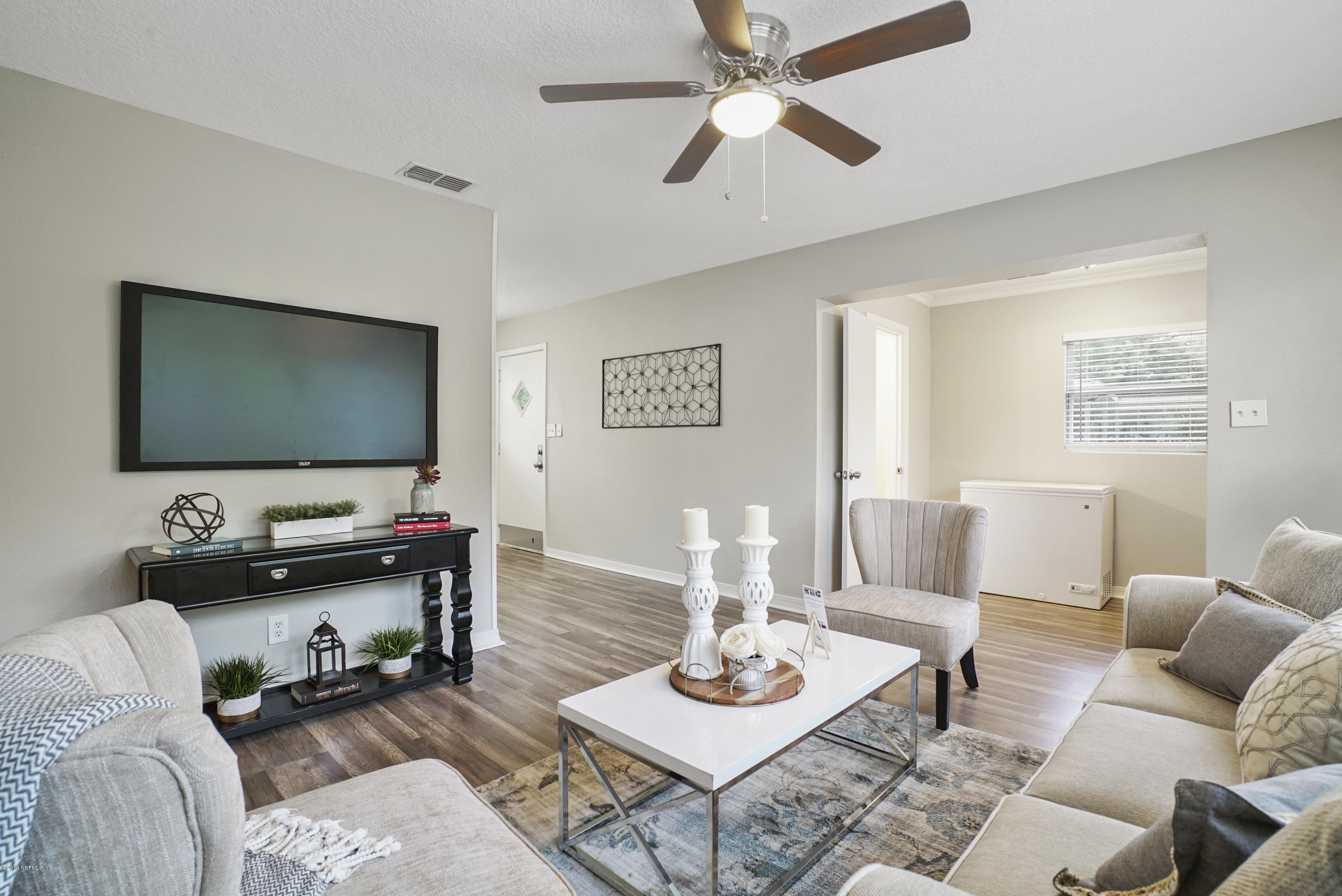 10506 Briarcliff Road South Jacksonville, FL 32218 - Photo 2 of 14 a living room with furniture and a flat screen tv