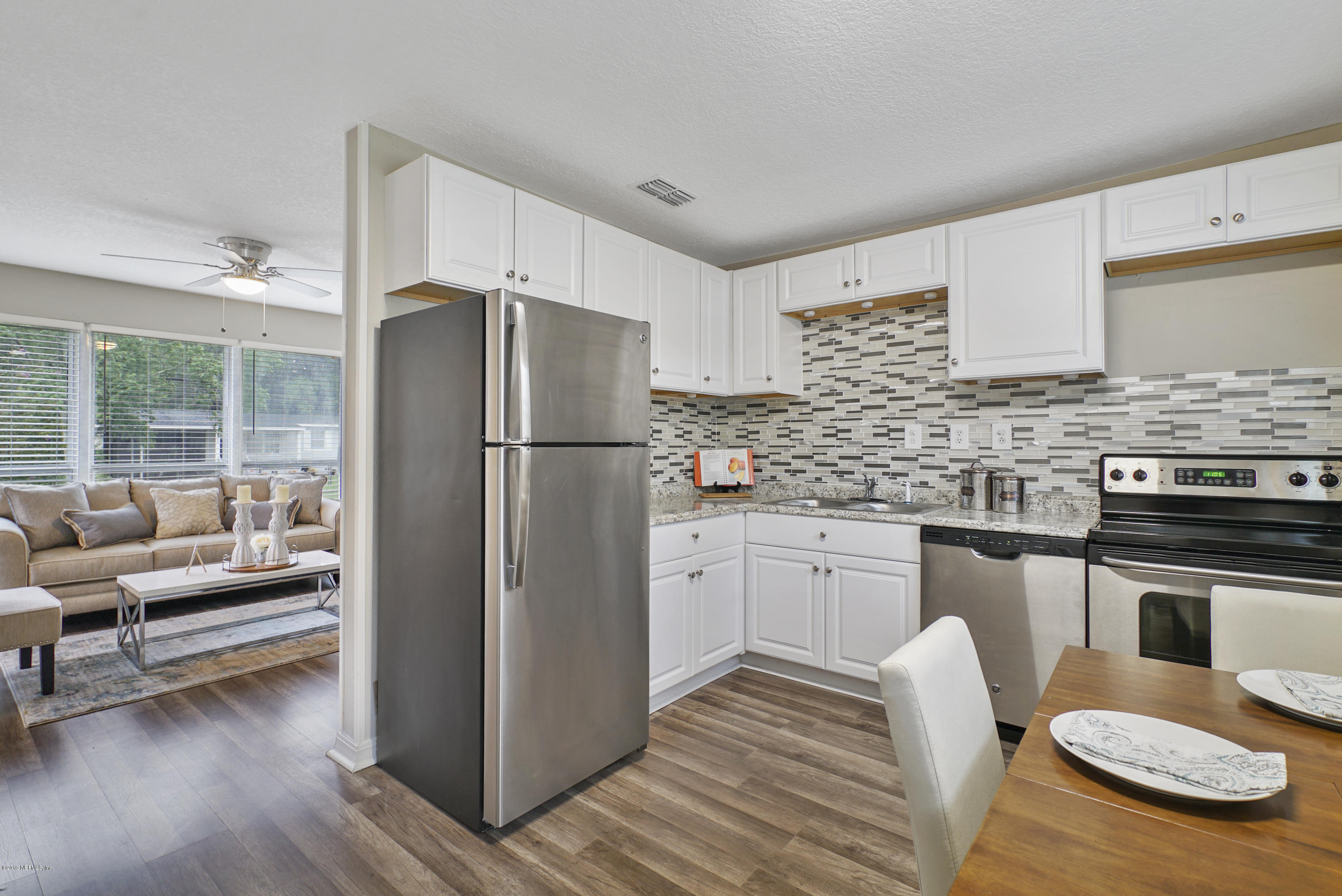 10506 Briarcliff Road South Jacksonville, FL 32218 - Photo 4 of 14 a kitchen with a refrigerator stove and sink