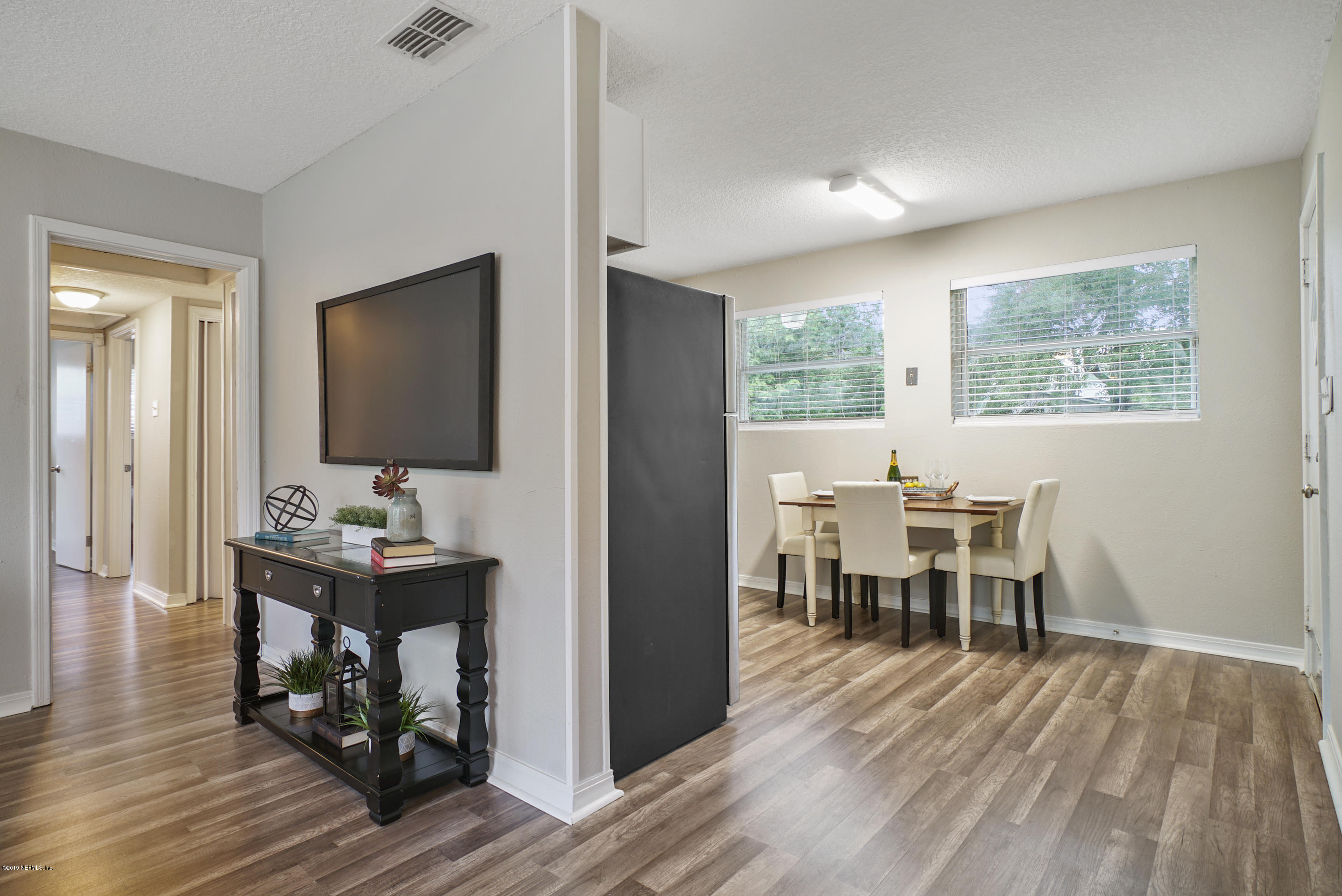 10506 Briarcliff Road South Jacksonville, FL 32218 - Photo 5 of 14 a view of a workspace with furniture and a window