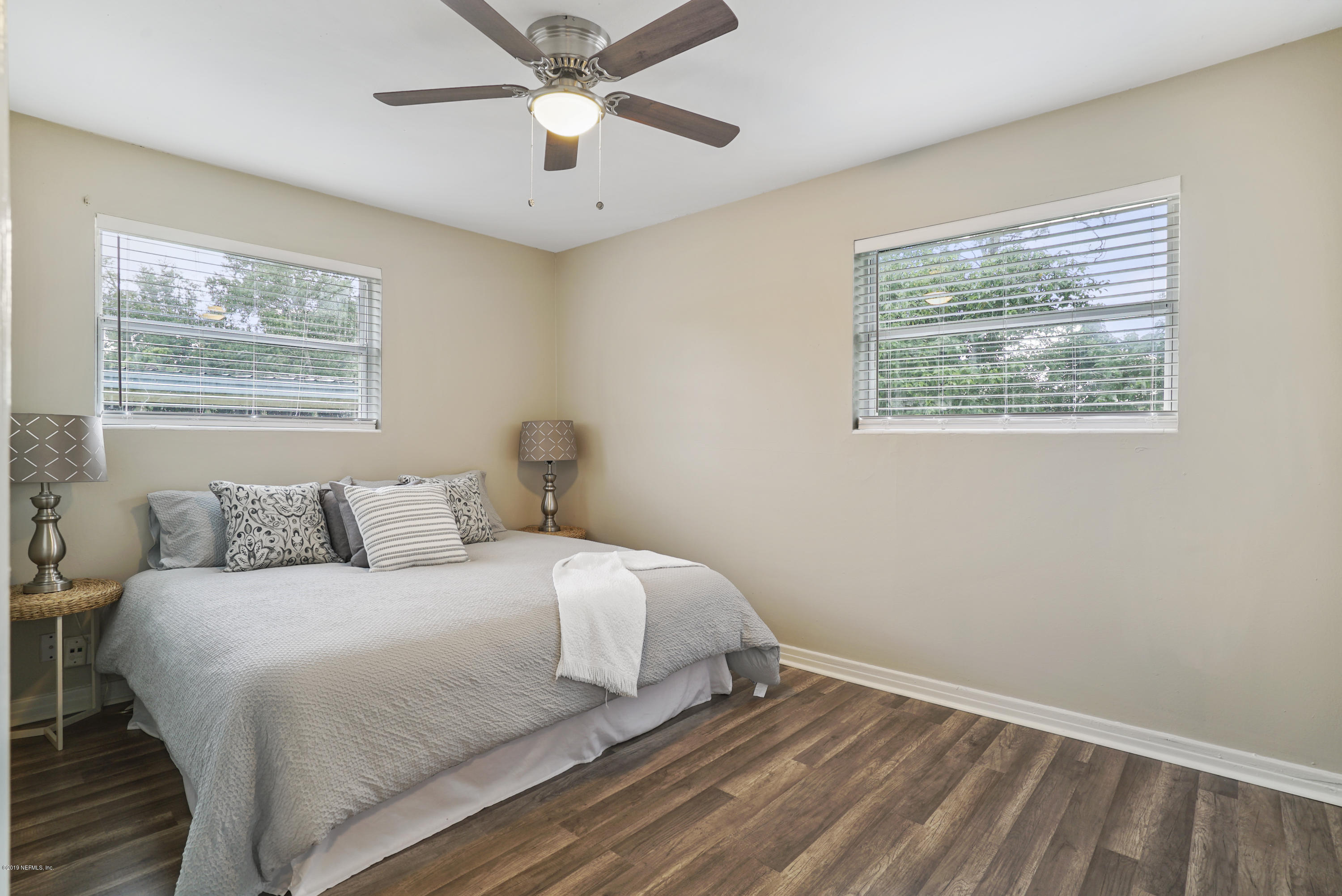 10506 Briarcliff Road South Jacksonville, FL 32218 - Photo 6 of 14 a bedroom with a large bed and a window