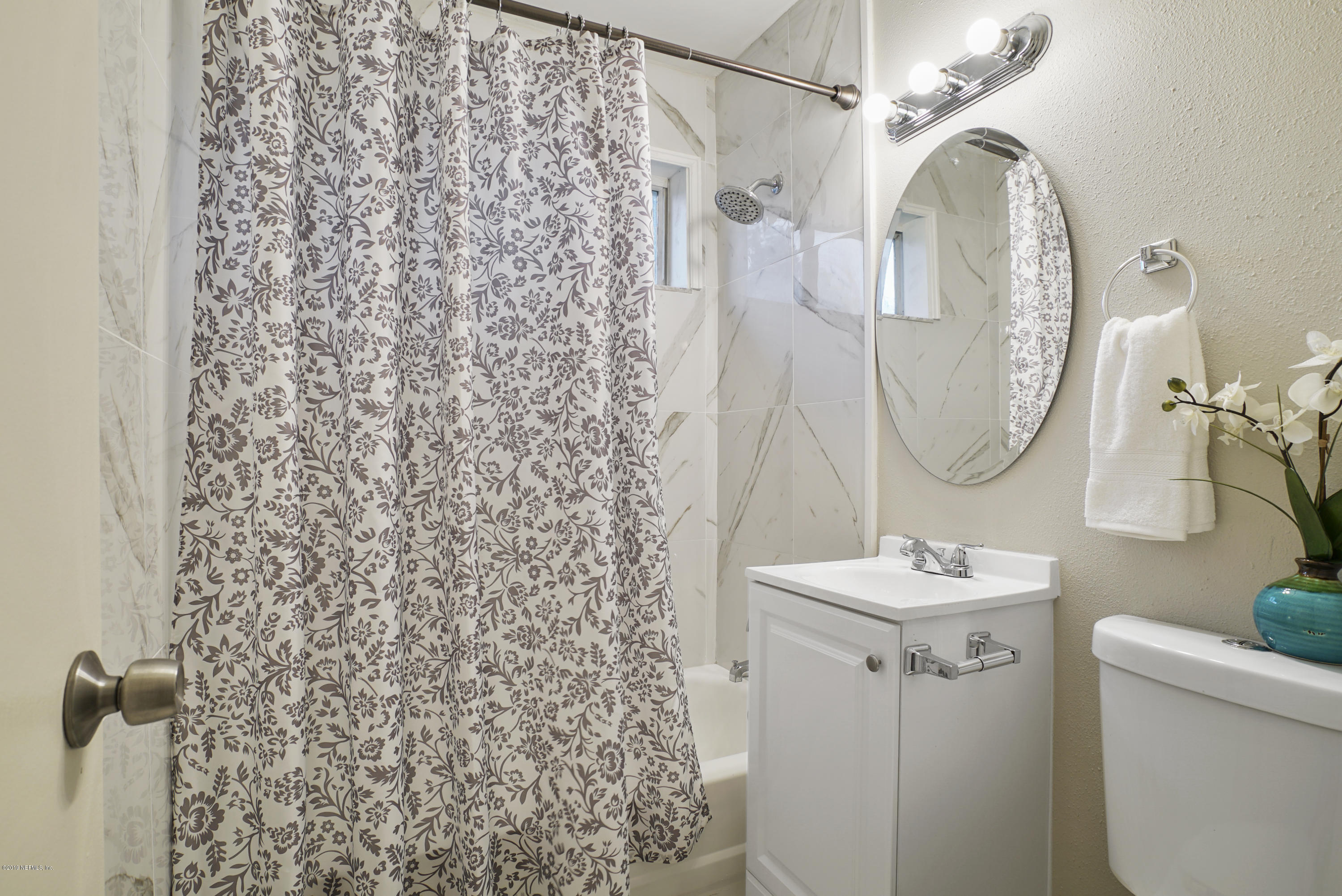 10506 Briarcliff Road South Jacksonville, FL 32218 - Photo 7 of 14 a bathroom with a sink and a mirror