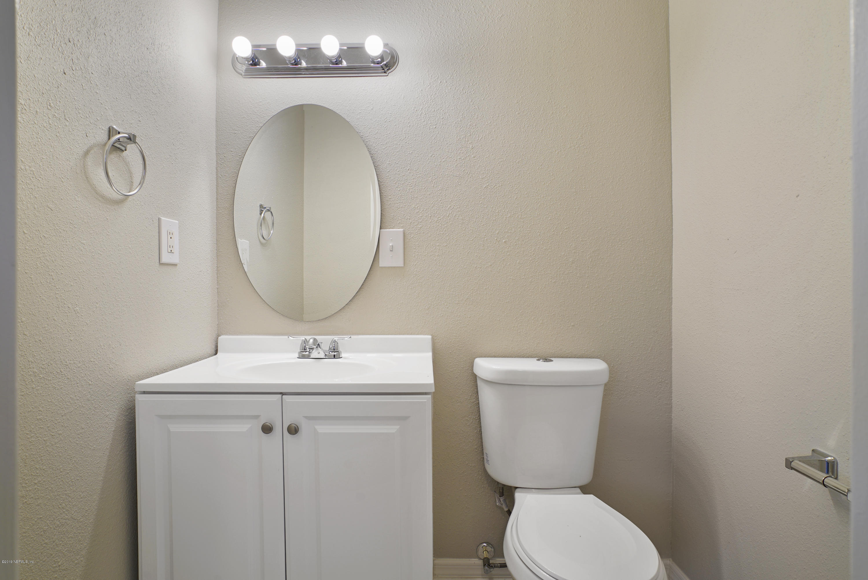 10506 Briarcliff Road South Jacksonville, FL 32218 - Photo 9 of 14 a bathroom with a toilet sink and mirror