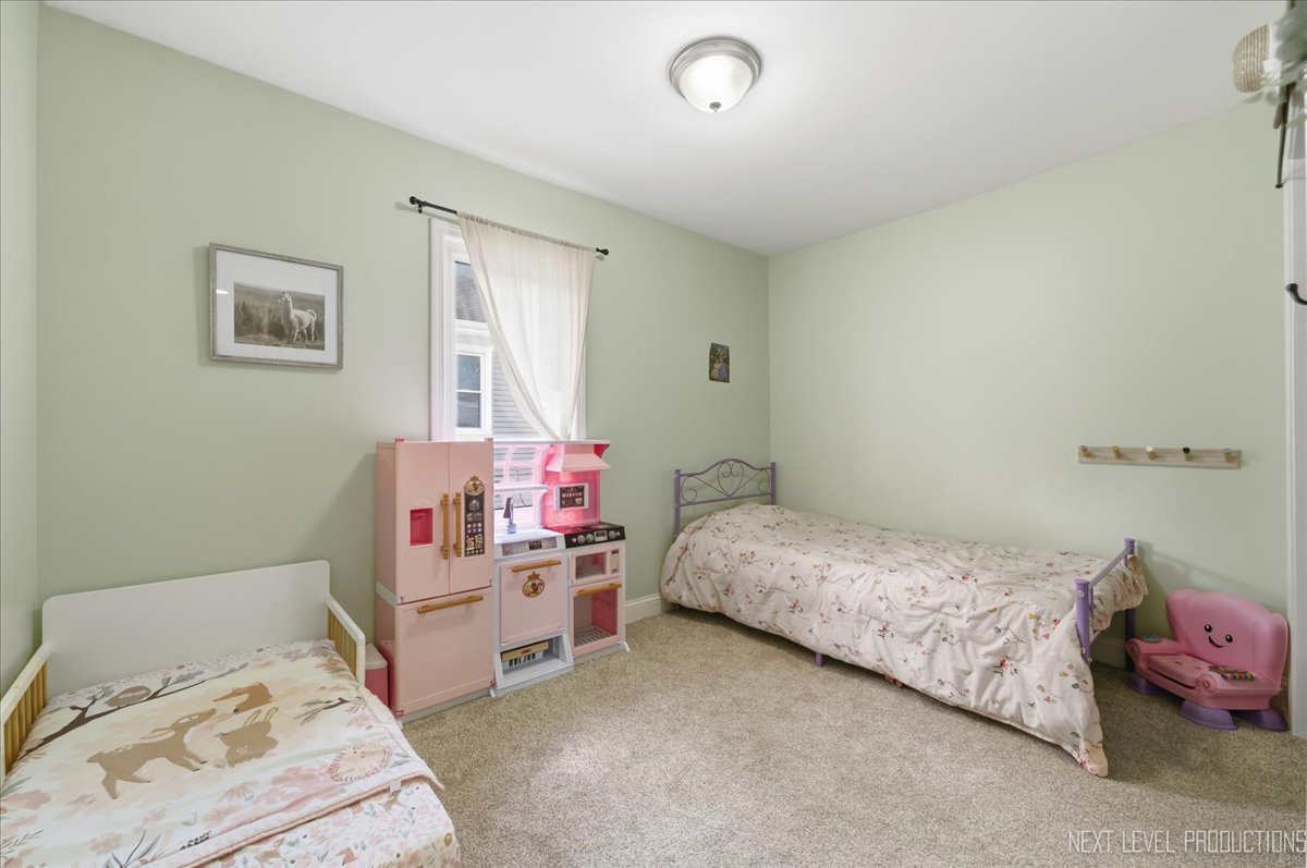 138 North Calhoun Street Aurora, IL 60505 - Photo 14 of 24 a bedroom with a bed and furniture