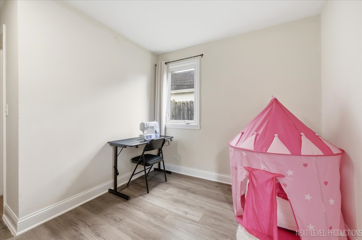 138 North Calhoun Street Aurora, IL 60505 - Photo 19 of 24 a view of a workspace with furniture and a window