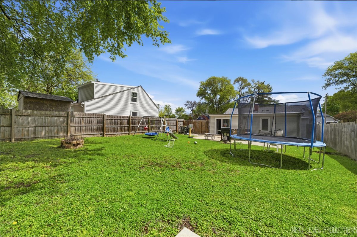 138 North Calhoun Street Aurora, IL 60505 - Photo 22 of 24 a view of house with backyard and a slide