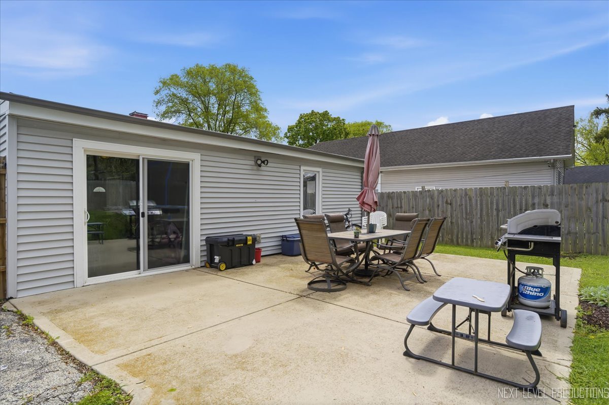 138 North Calhoun Street Aurora, IL 60505 - Photo 24 of 24 a view of a patio with a table and chairs