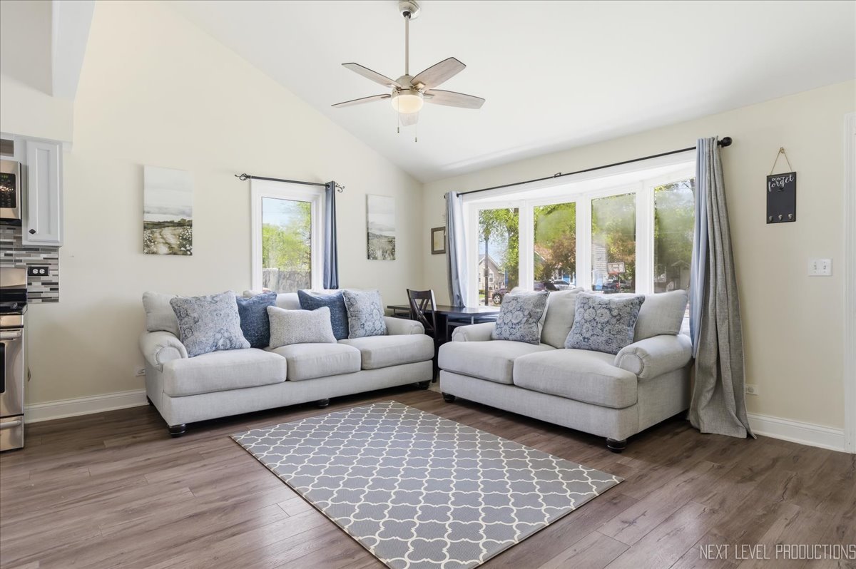 138 North Calhoun Street Aurora, IL 60505 - Photo 4 of 24 a living room with furniture and a large window