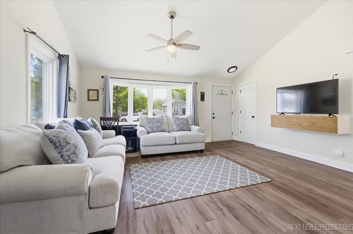 138 North Calhoun Street Aurora, IL 60505 - Photo 6 of 24 a living room with furniture and a flat screen tv