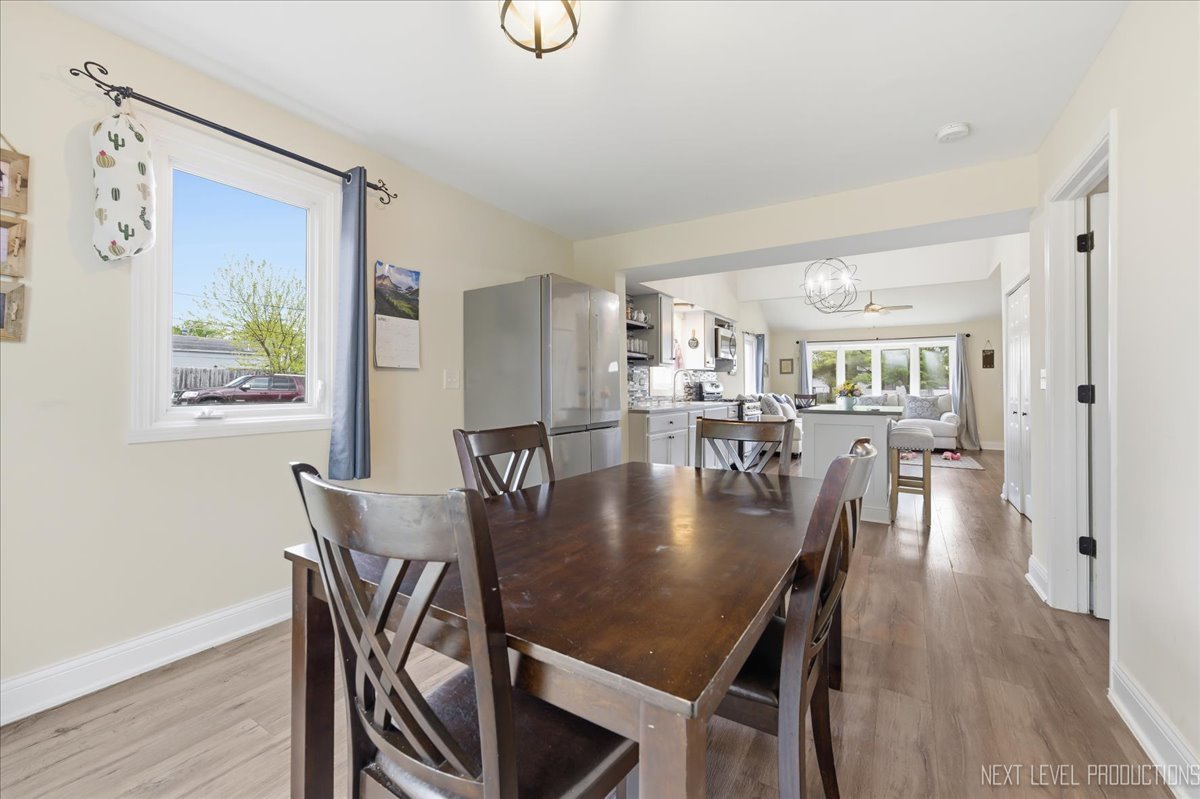 138 North Calhoun Street Aurora, IL 60505 - Photo 8 of 24 a dining room with furniture and wooden floor