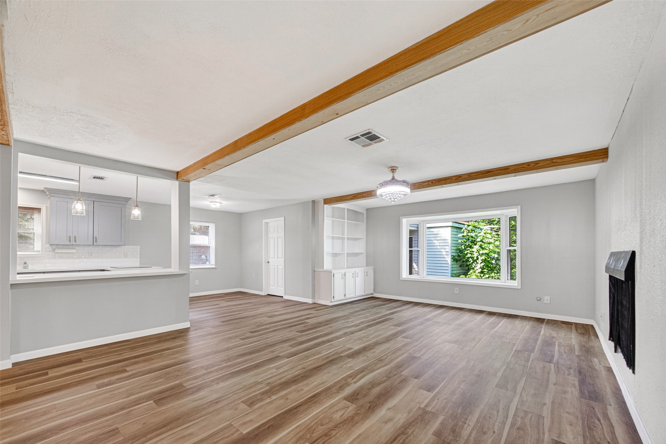 25503 Foxbriar Lane Spring, TX 77373 - Photo 20 of 45 an empty room with wooden floor and windows