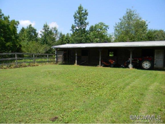 592 Scoggins Road Rutherfordton, NC 28139 - Photo 13 of 22 a view of a house with a yard and a tree