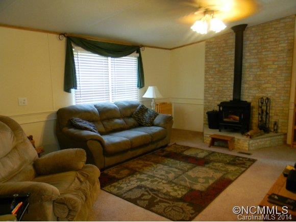 592 Scoggins Road Rutherfordton, NC 28139 - Photo 20 of 22 a living room with furniture and a window