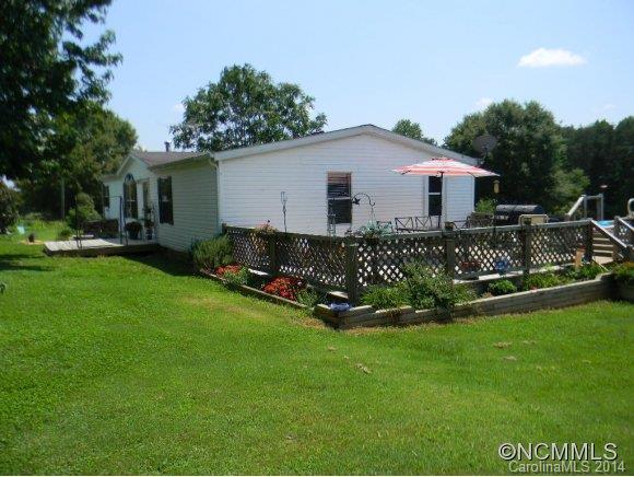 592 Scoggins Road Rutherfordton, NC 28139 - Photo 3 of 22 a view of a house with a yard and sitting area