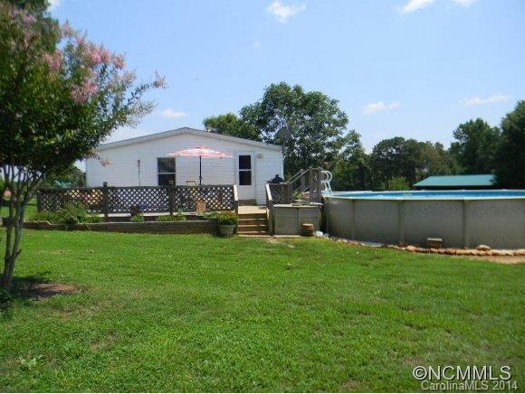 592 Scoggins Road Rutherfordton, NC 28139 - Photo 5 of 22 a front view of house with a garden