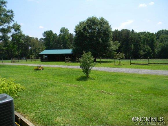 592 Scoggins Road Rutherfordton, NC 28139 - Photo 9 of 22 a view of field with grass and a trees
