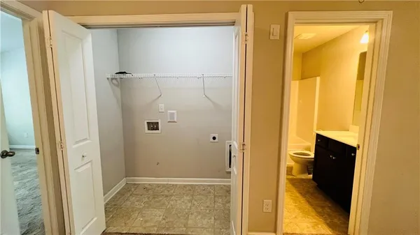 a view of a bathroom with a glass door