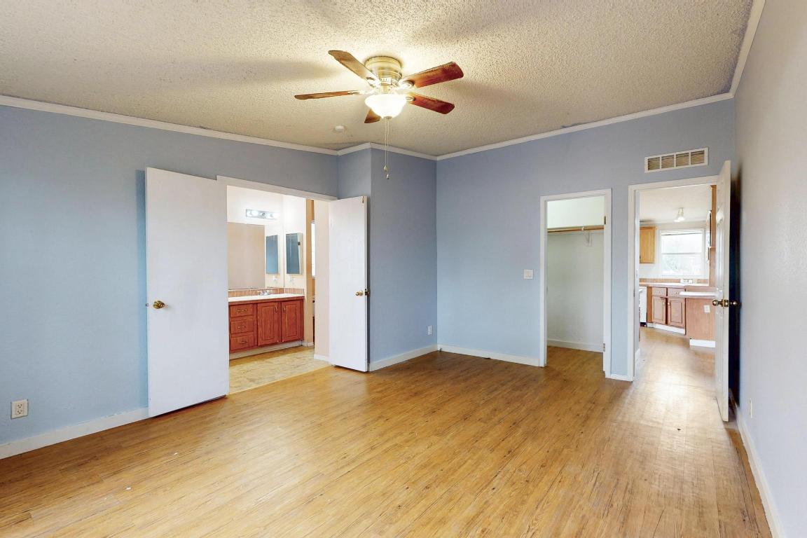 262 Highway 290 Highway East Elgin, TX 78621 - Photo 17 of 37 a view of livingroom with hardwood floor and a ceiling fan