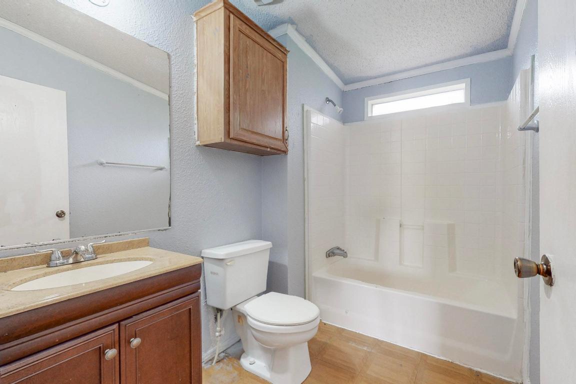 262 Highway 290 Highway East Elgin, TX 78621 - Photo 5 of 37 a bathroom with a sink toilet and shower