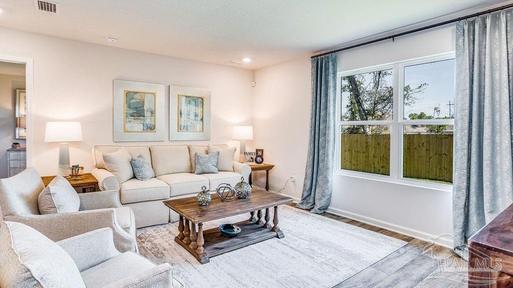 5078 Rainwater Road Milton, FL 32583 - Photo 12 of 26 a living room with furniture and a window