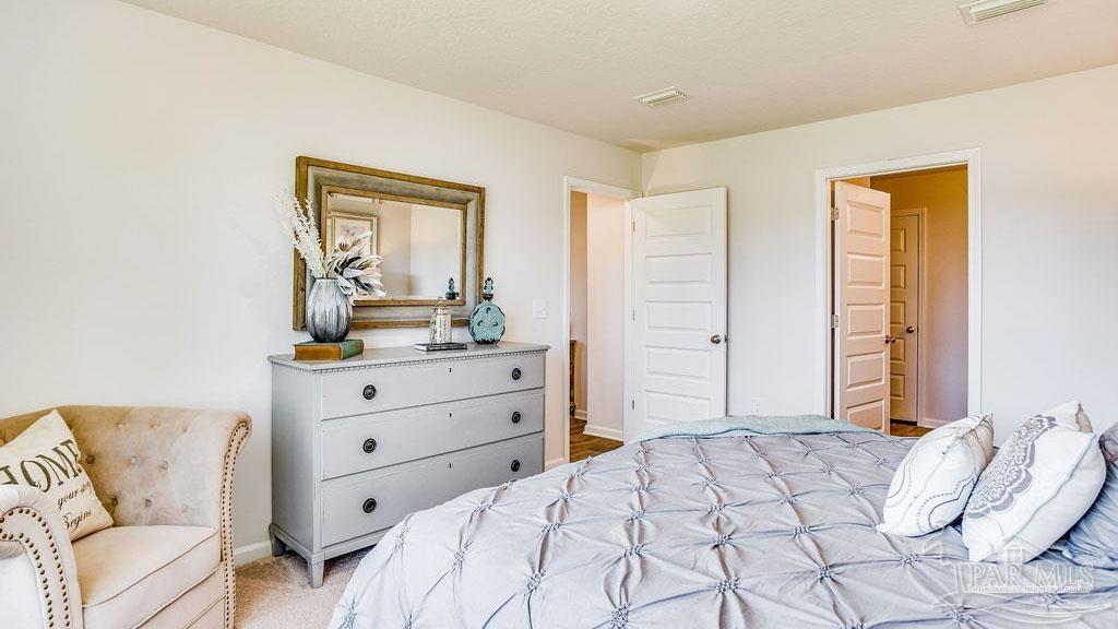 5078 Rainwater Road Milton, FL 32583 - Photo 16 of 26 a bedroom with a bed and a window