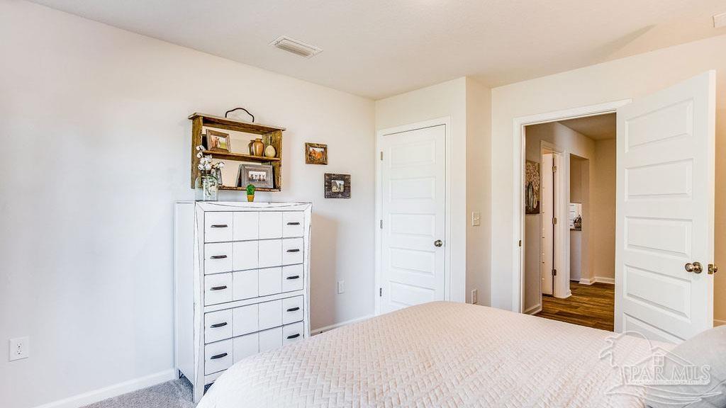 5078 Rainwater Road Milton, FL 32583 - Photo 25 of 26 a bedroom with a bed and closet