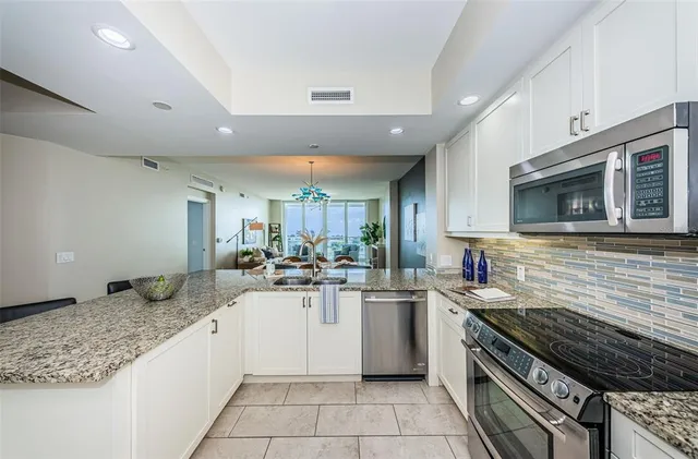 a kitchen with lots of counter top space and appliances