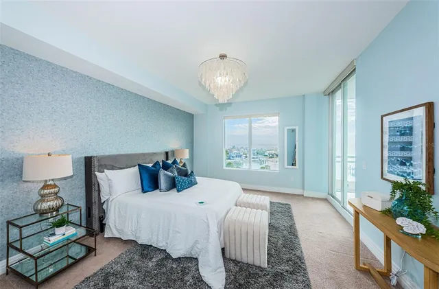 a bedroom with bed and a window