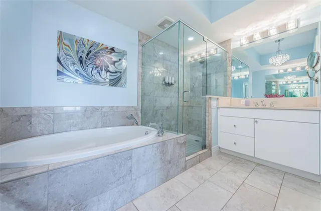 a spacious bathroom with a bathtub and a shower