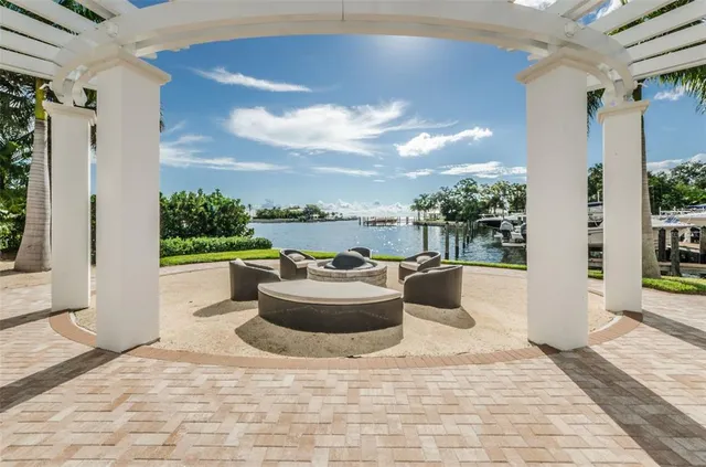 a view of a patio with couches and potted plants