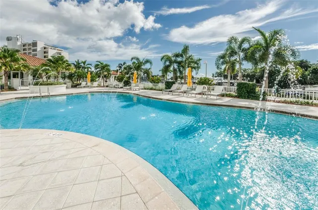 a view of a swimming pool with an outdoor seating