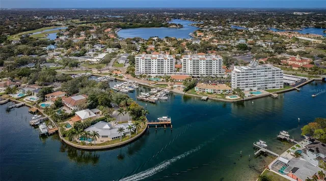 an aerial view of a house with a lake view