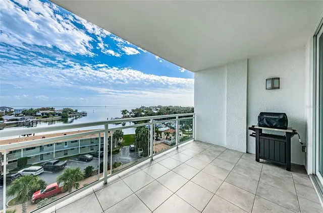 a view of a chairs and a table in a balcony