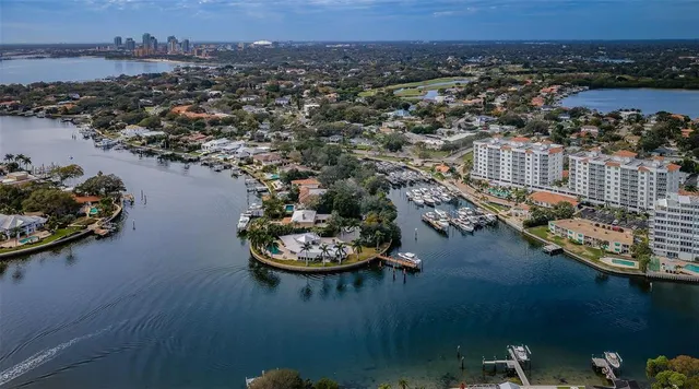 an aerial view of a house with a lake view